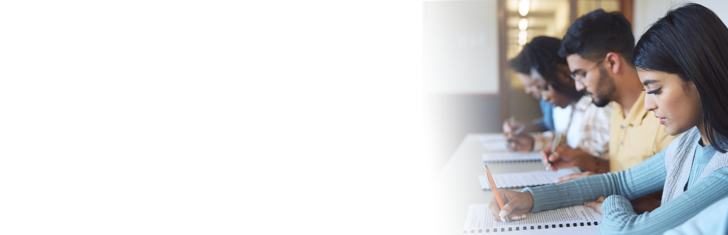 College students doing a writing assignment in class